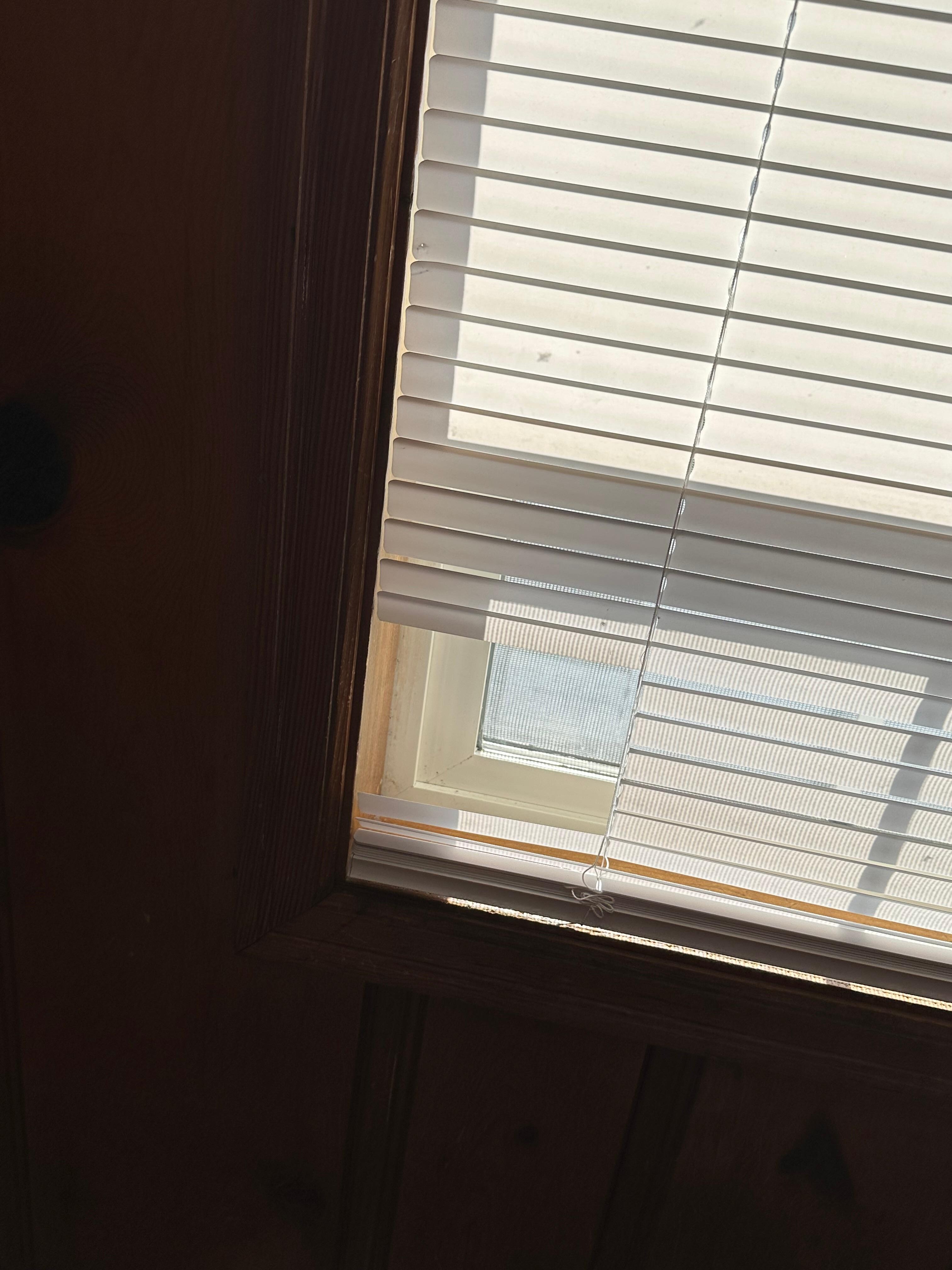 Broken blinds in bedroom