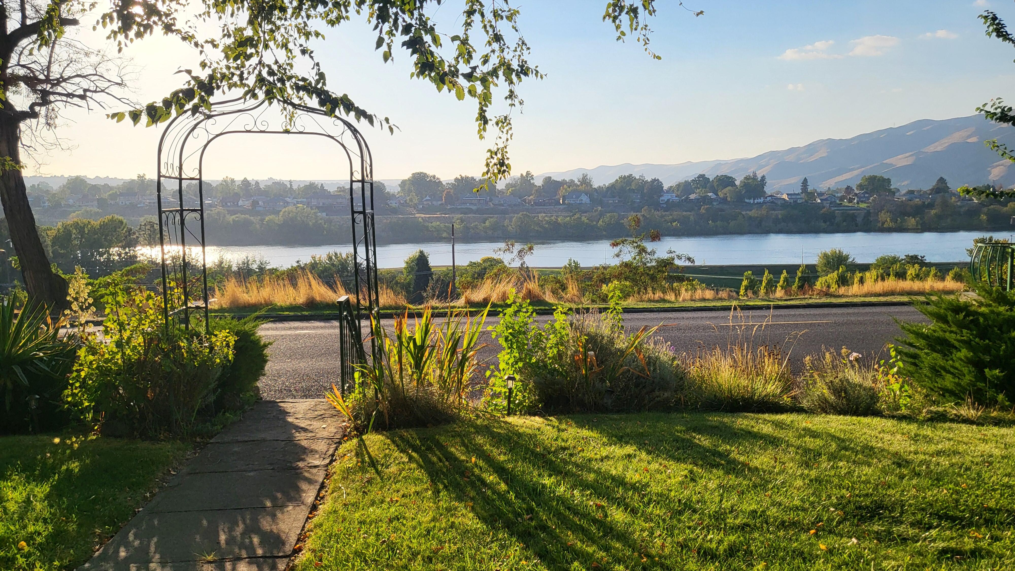 Shadow on the lawn overlooking the river