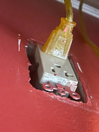 Bedside outlet plate missing and electrical not secured