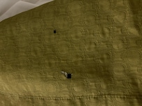 Example of burn holes in bedding