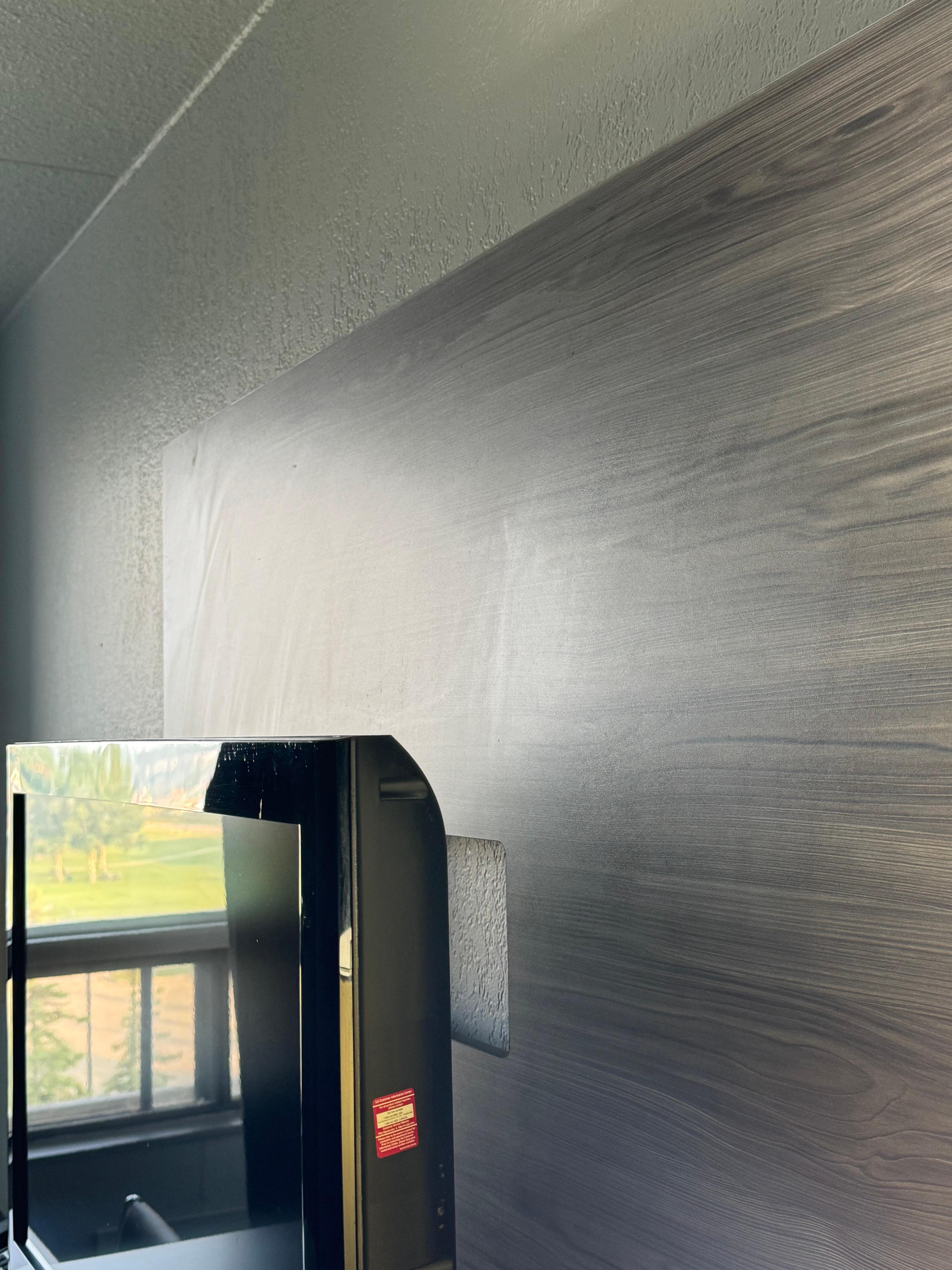 The wall behind the TV has big wipe marks. Does not appear to be very clean. 