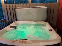 Outdoor covered porch hot tub & fireplace
