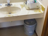 5 gallon paint can in bathroom