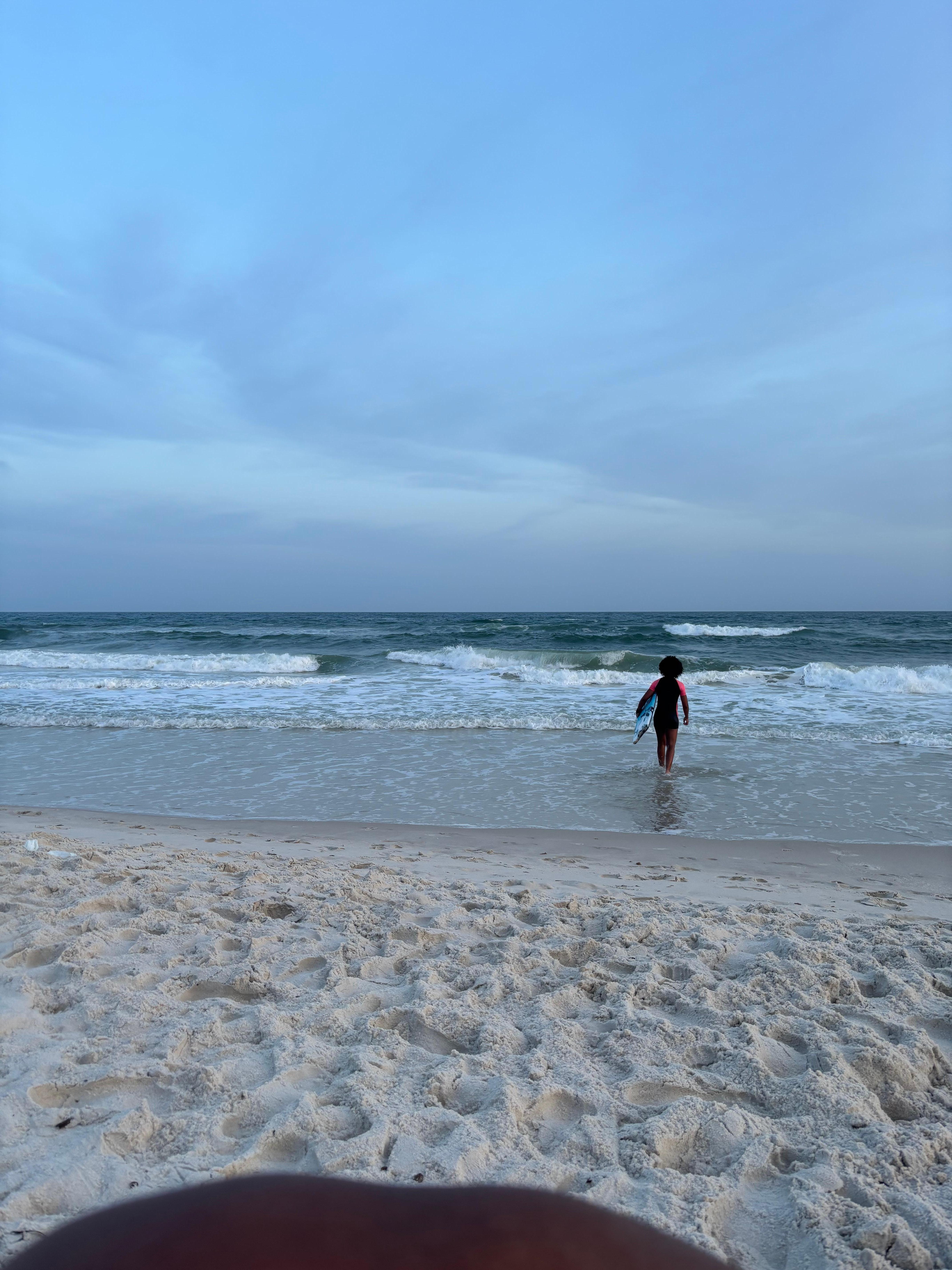 Using the Cove202 skimboard at the beach within walking distance to the condo after dinner