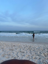 Using the Cove202 skimboard at the beach within walking distance to the condo after dinner