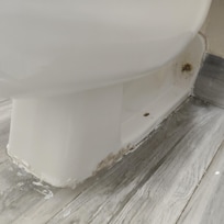 Caulk around toilet