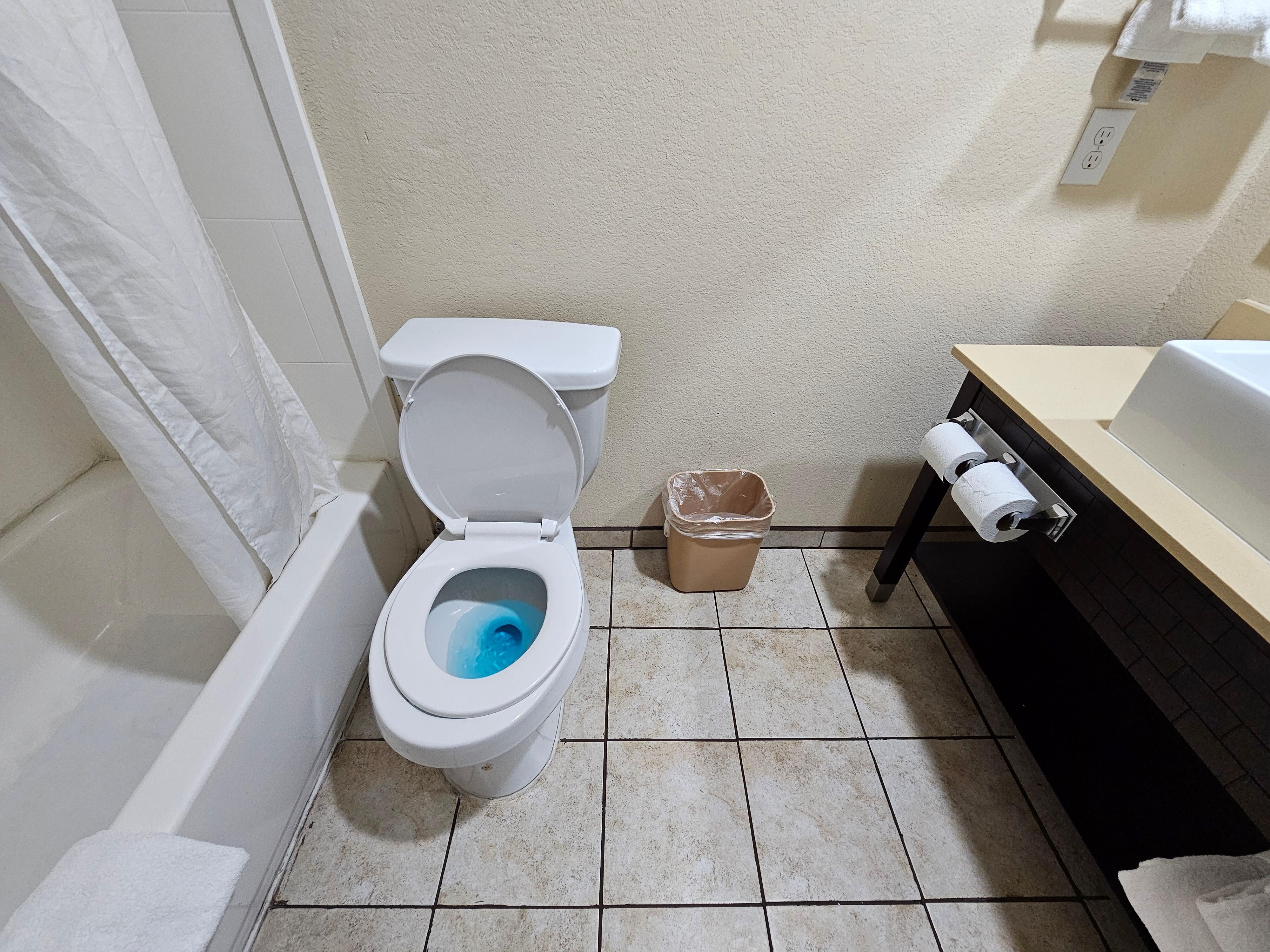The bathroom was dingy, and the toilet seat didn't even fit the bowl