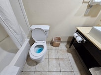 The bathroom was dingy, and the toilet seat didn't even fit the bowl