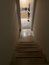 Stairs with no lights and railing