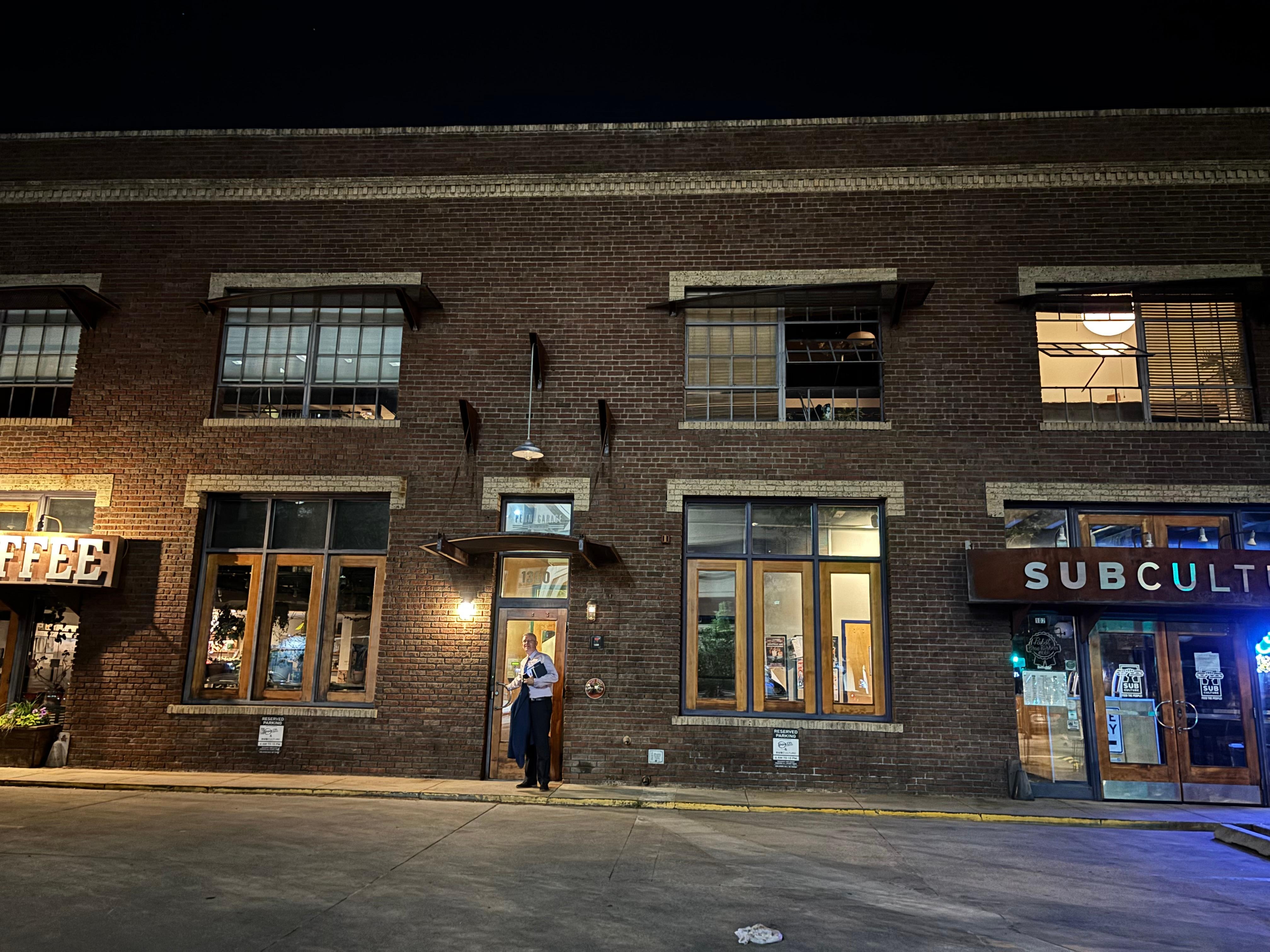 The entrance is between two businesses. Pablo’s Coffee and SubCulture.