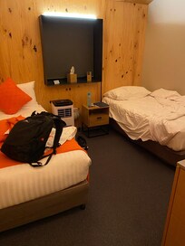 A/C unit, no plugs near bed head