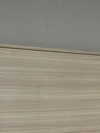 Something splattered all over the headboard.