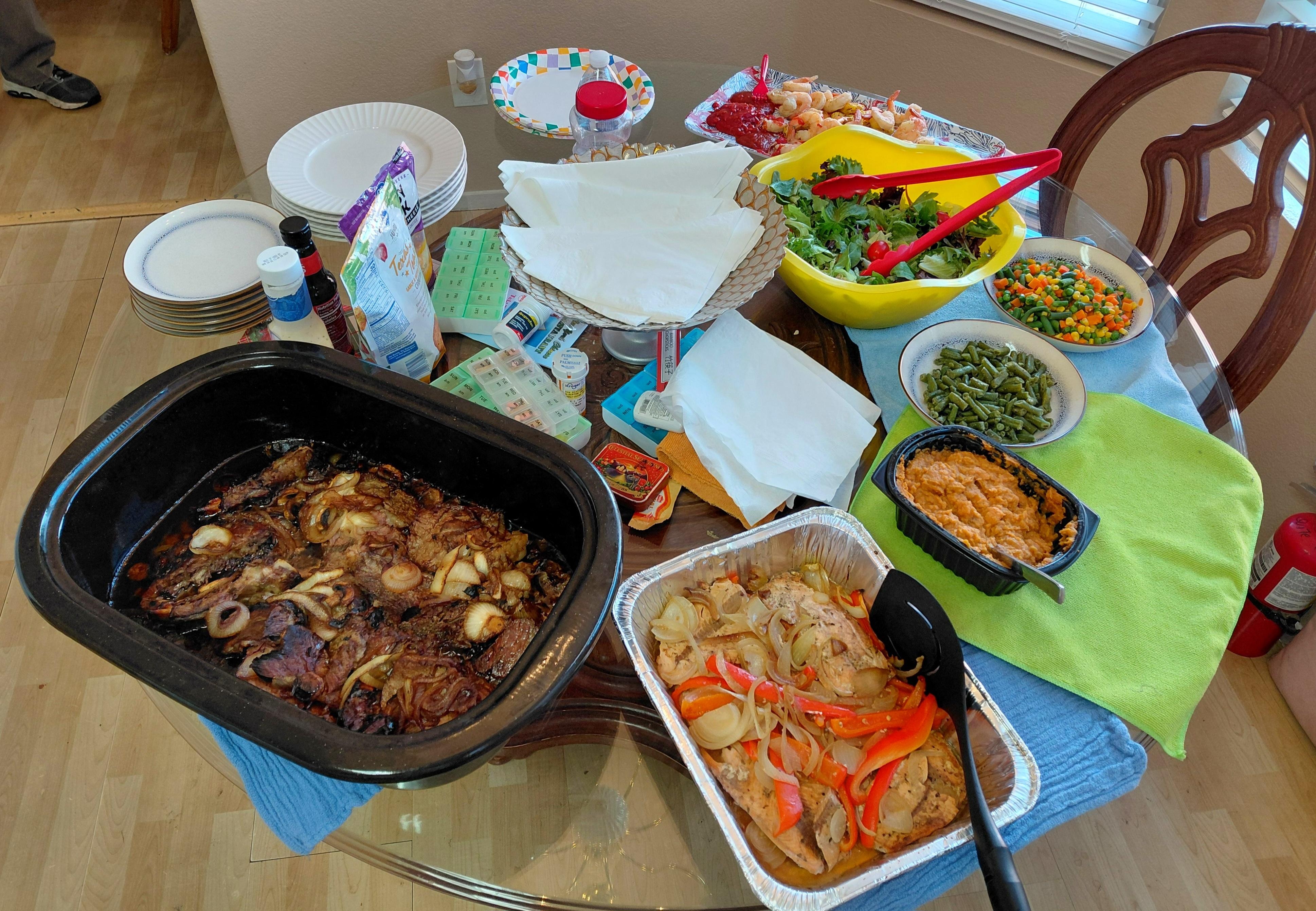 A well appointed Christmas dinner - prime rib, salmon, veggies and salad