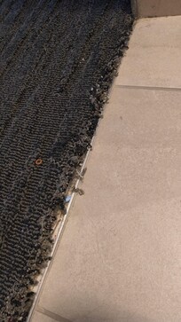 Look closely you can see the red tack strip