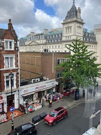 Through the space between the buildings left of Ginkgo tree is the underground station from which the previous pic was taken. The street is London, Aberdeen Steak house is on corner behind the tree.
