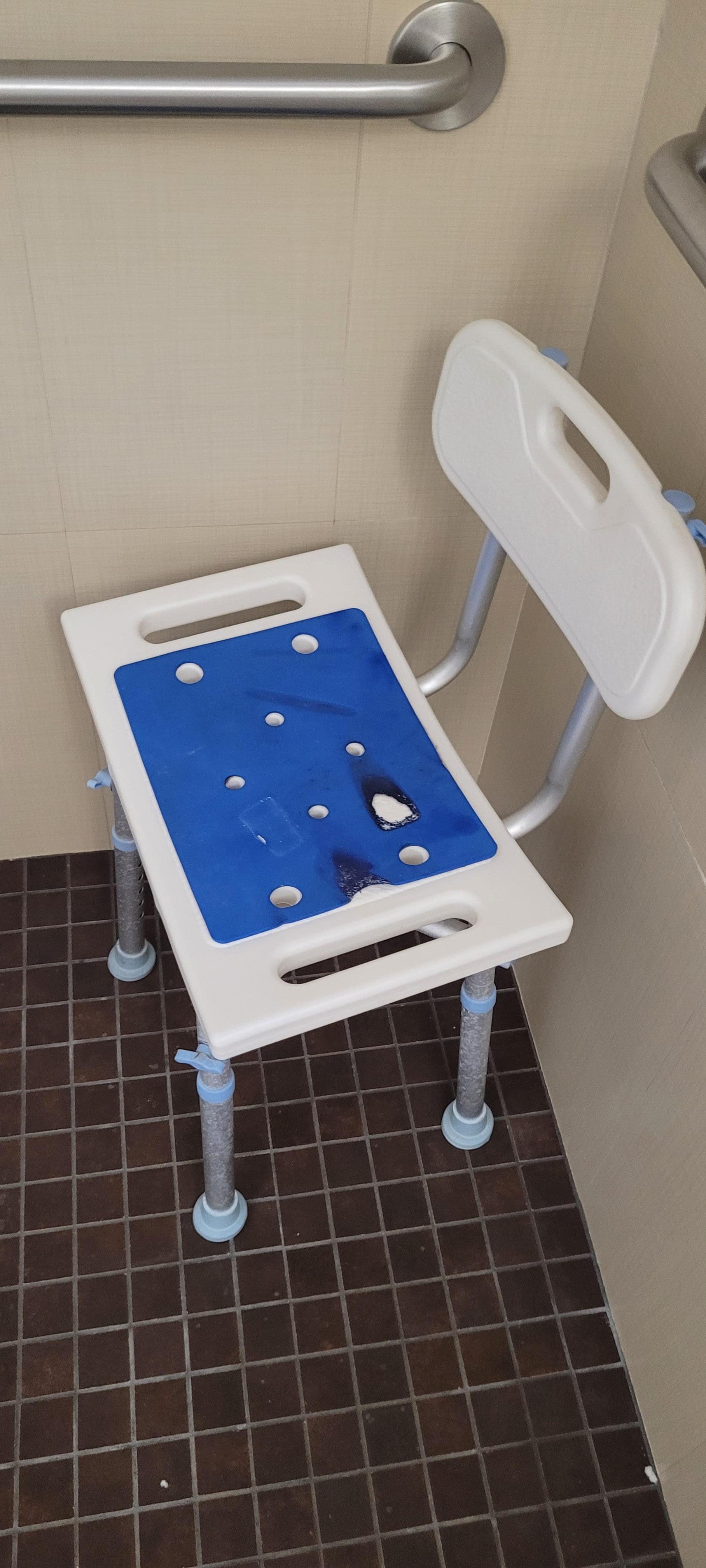 Dingy  stained bath chair