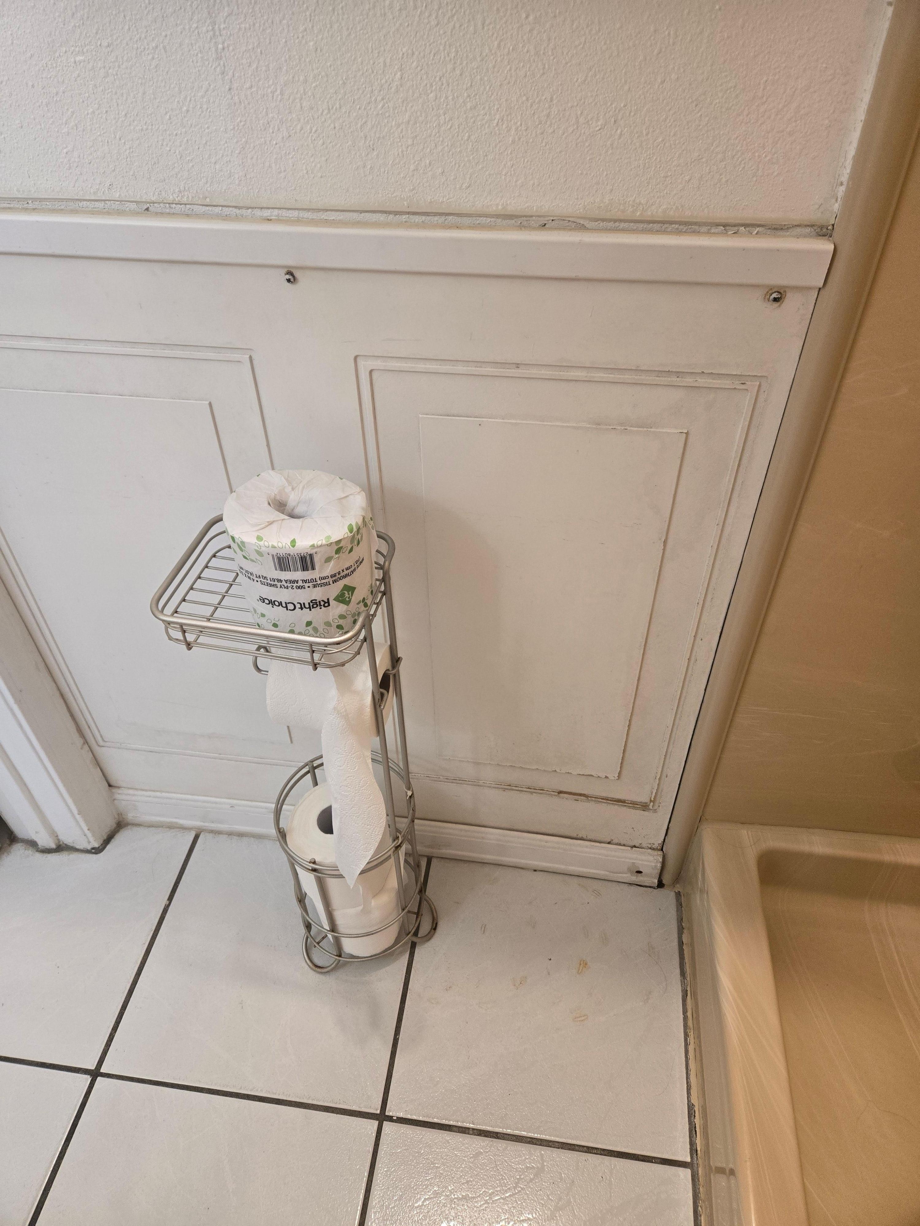 Rough looking panel and rust spots on floor.