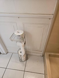 Rough looking panel and rust spots on floor.