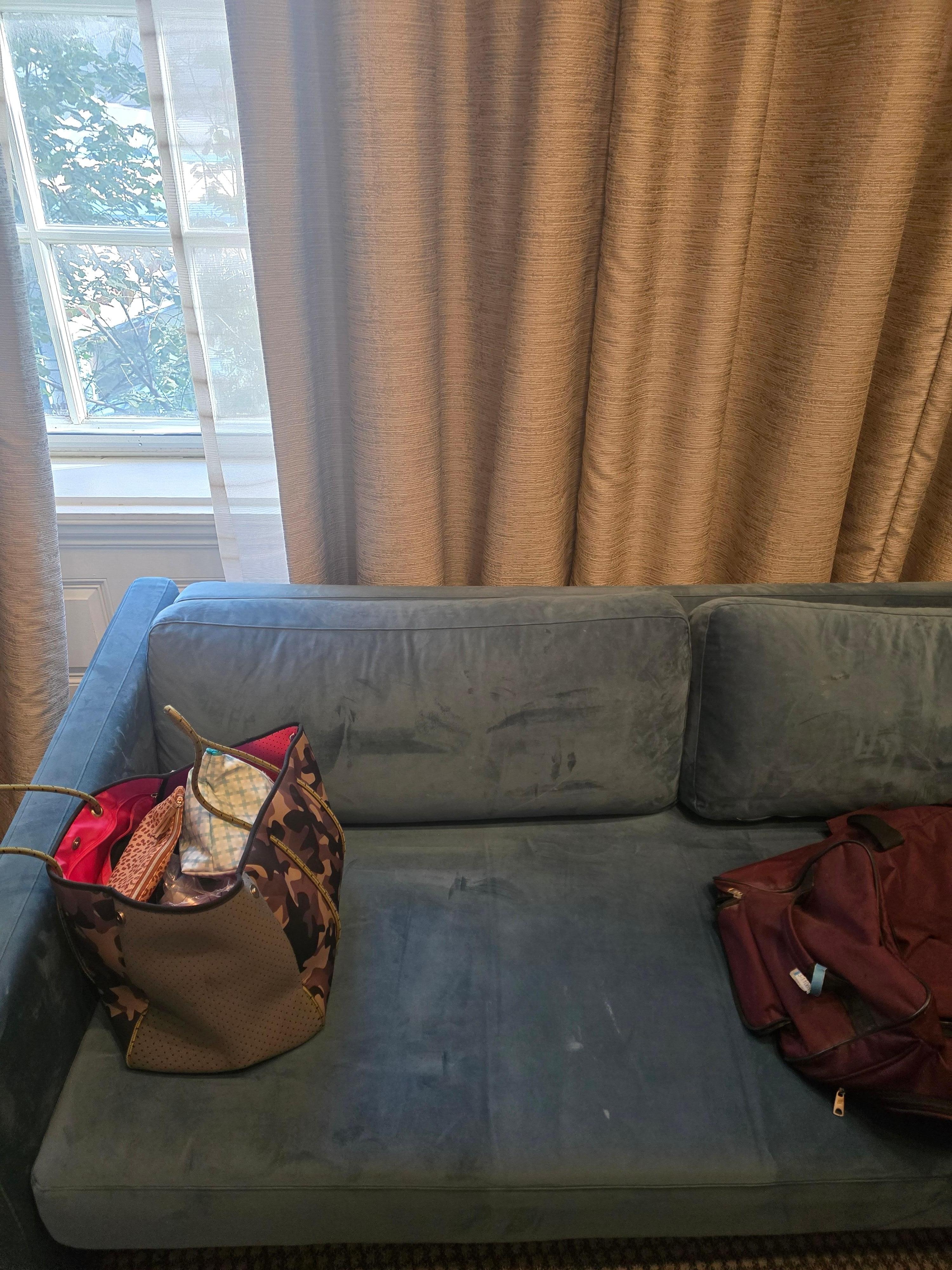 Old couch thrown in room.