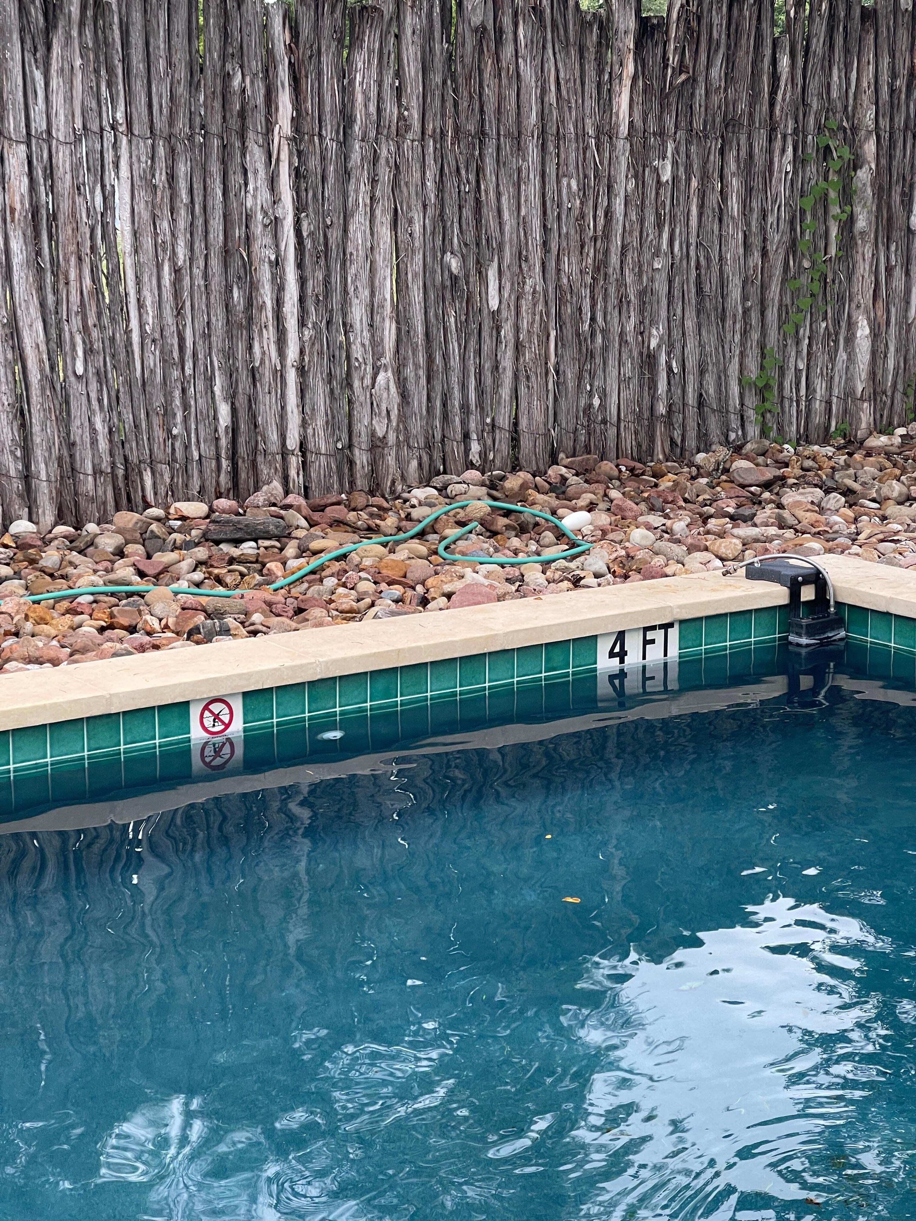 I wish I could attach my entire letter I wrote to Cozi Rentals.
No grass just these rocks and the garden hose that was not connected to anything.