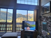 On checkout day, the smart TV suggested some Bob Ross! 🤣  He's painting the view from the couch! RIP 🎨