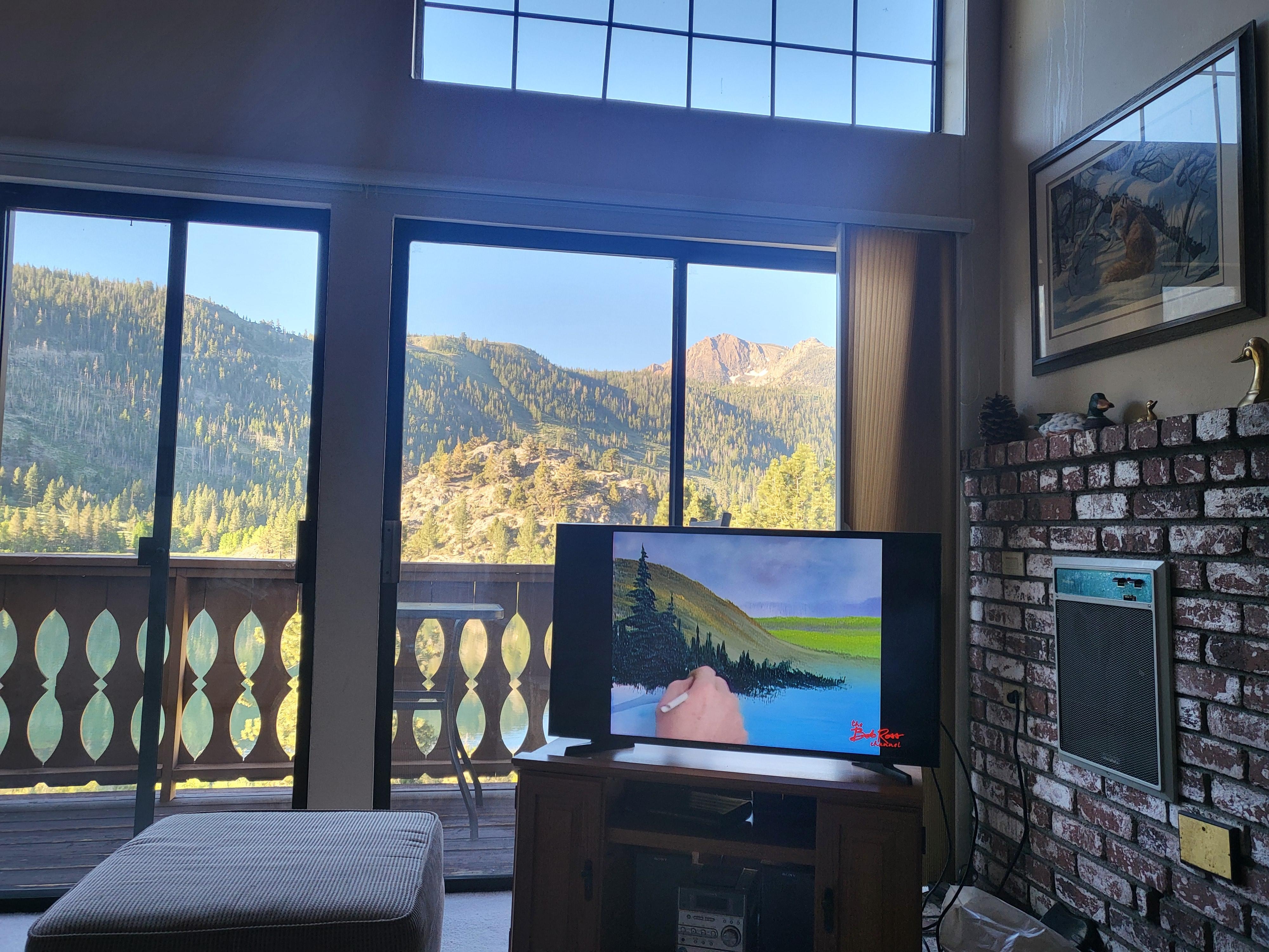 On checkout day, the smart TV suggested some Bob Ross! 🤣 He's painting the view from the couch! RIP 🎨