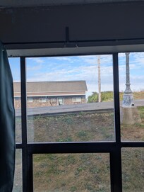 The only view out the window is of bird turned its stuck on the glass.