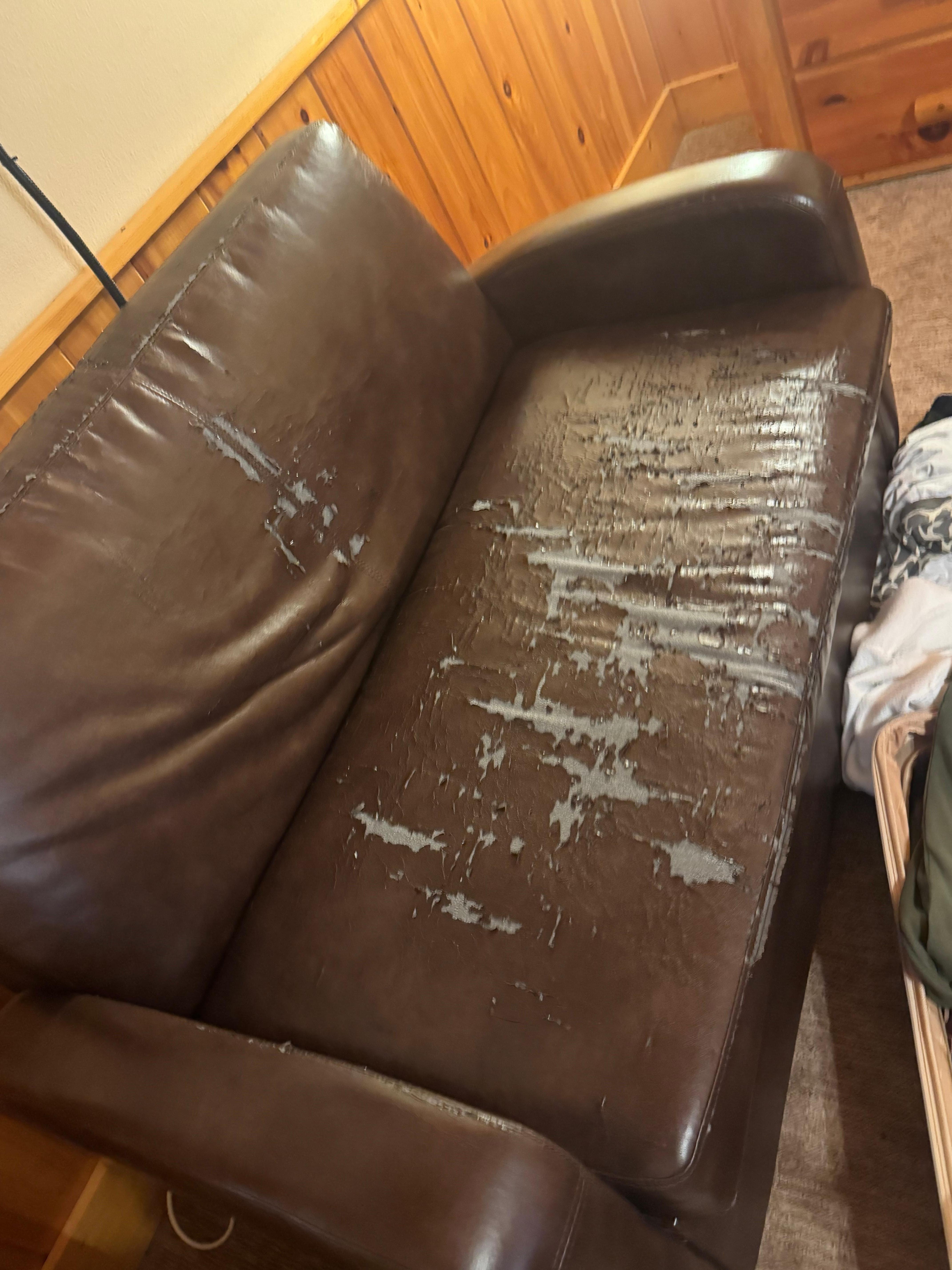 Couch in master bedroom that needs thrown in trash