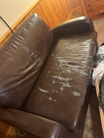 Couch in master bedroom that needs thrown in trash