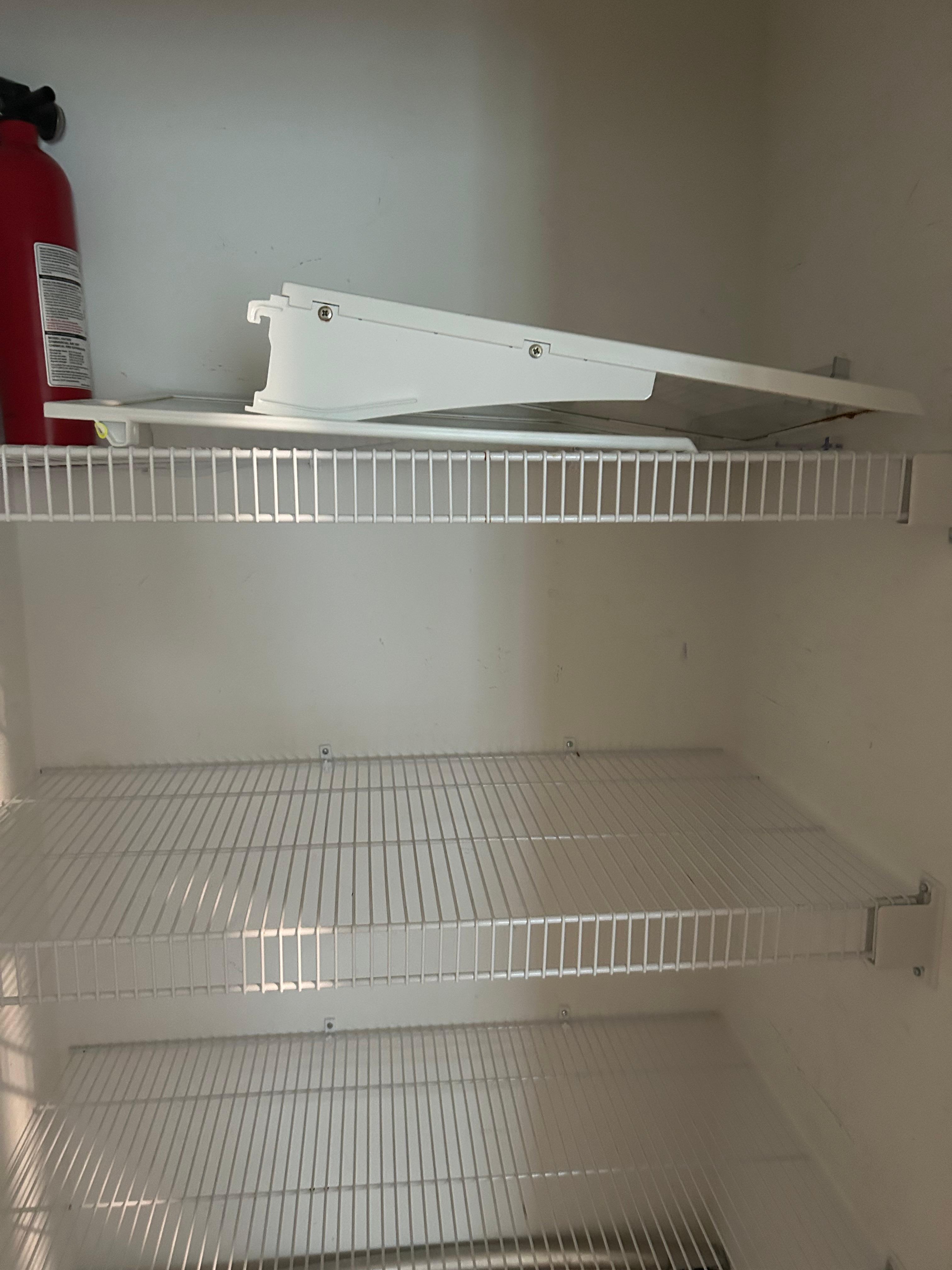 Parts of the shelf from refrigerator in closet in kitchen 