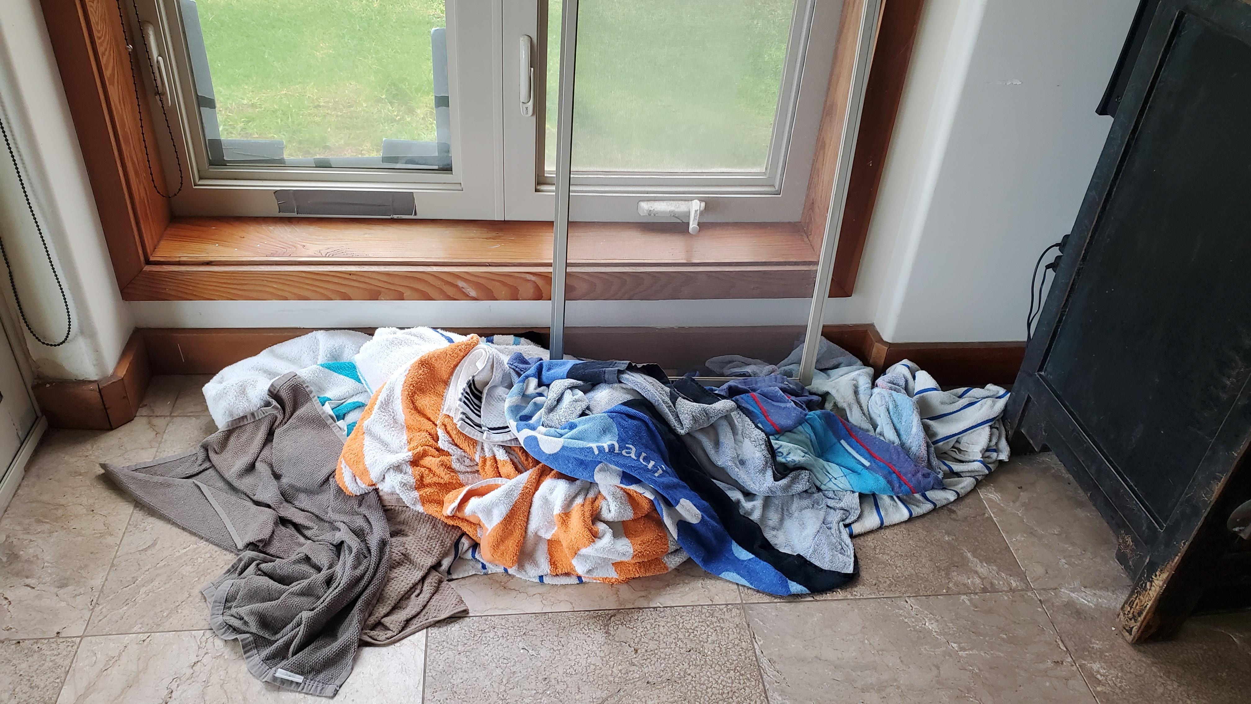 Water pouring in through a window where the crank was missing