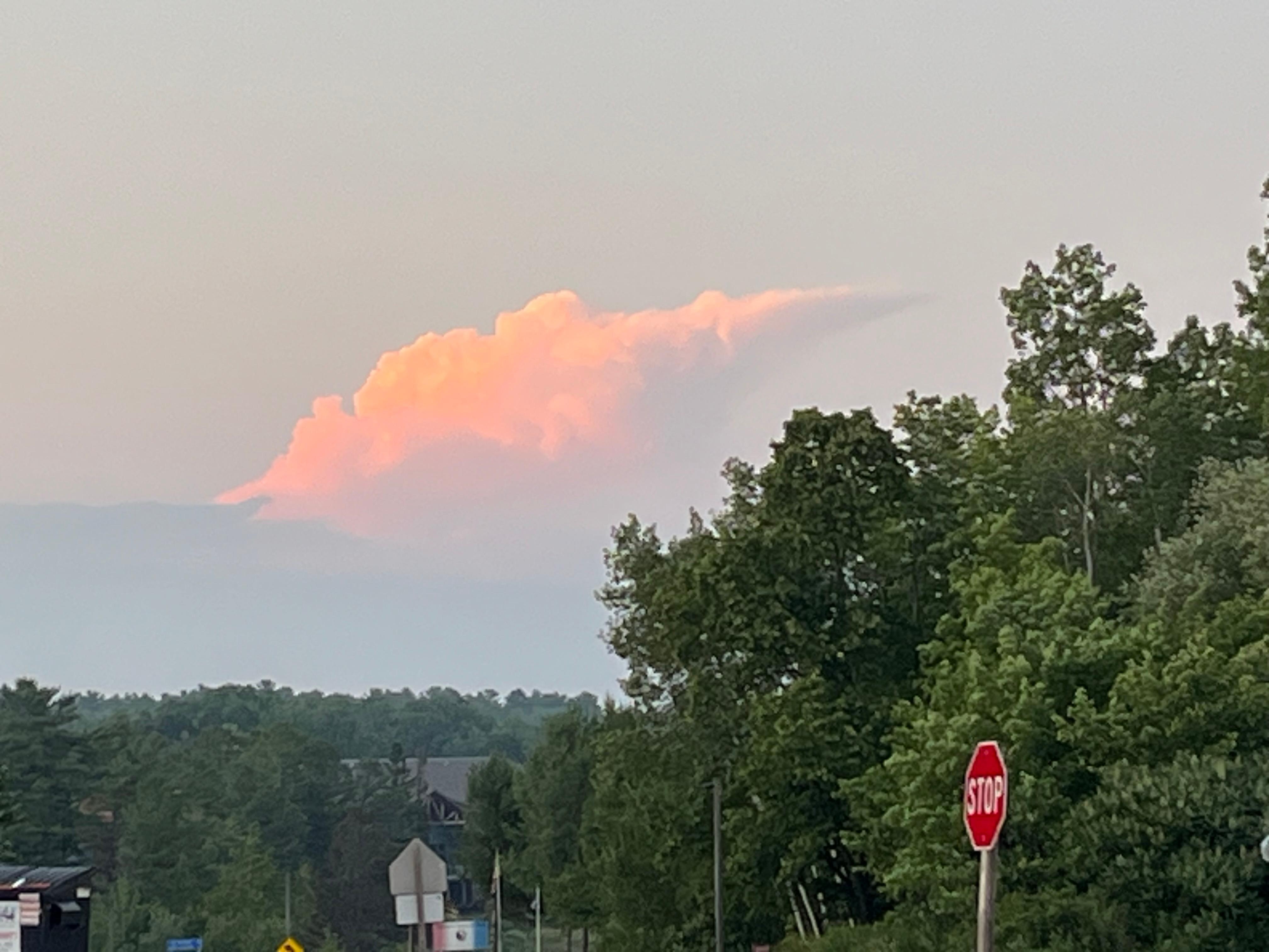 Northward view of an amazing cloud lit at sunset. 