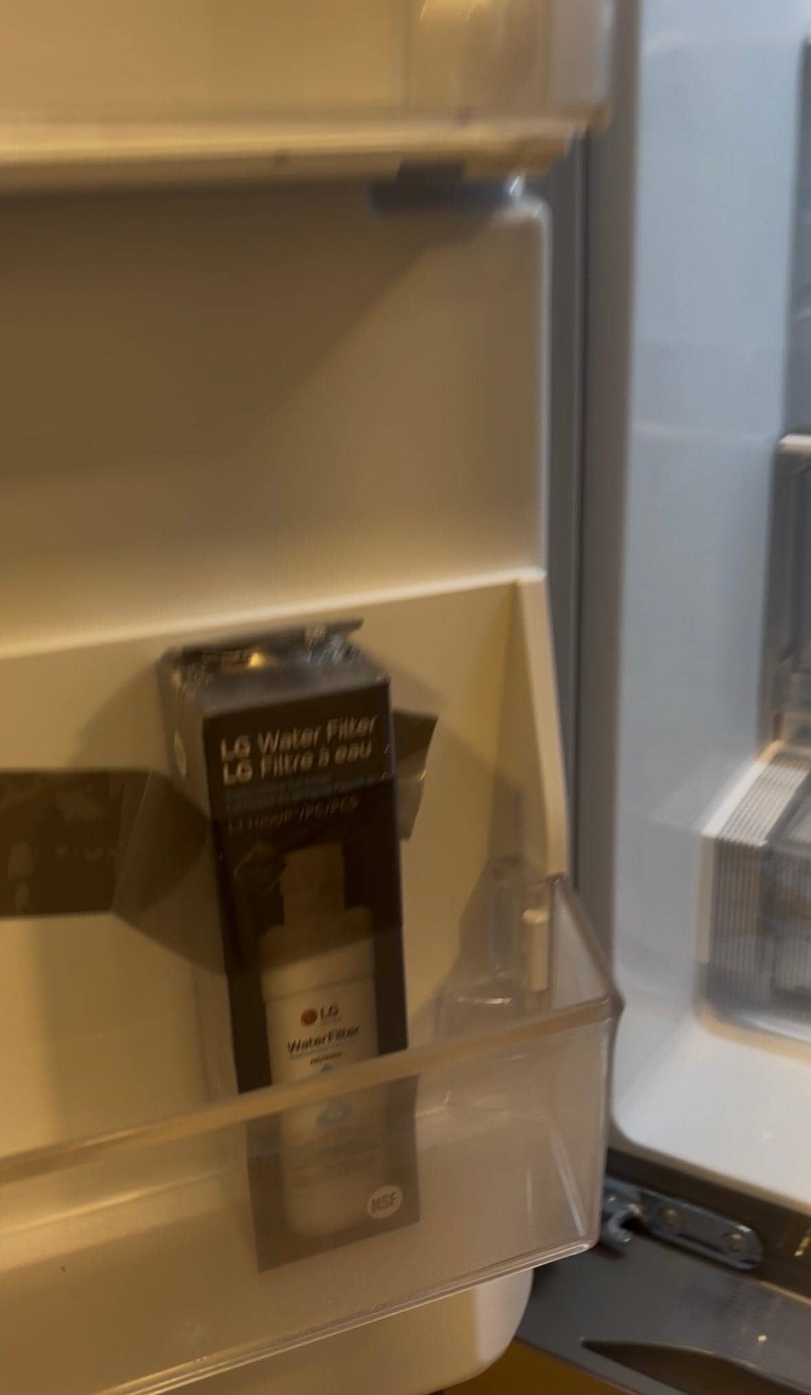 Fridge water filter not installed, drawers still taped shut