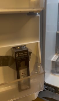 Fridge water filter not installed, drawers still taped shut