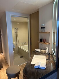 Separate bathroom, toilet and washbasin.