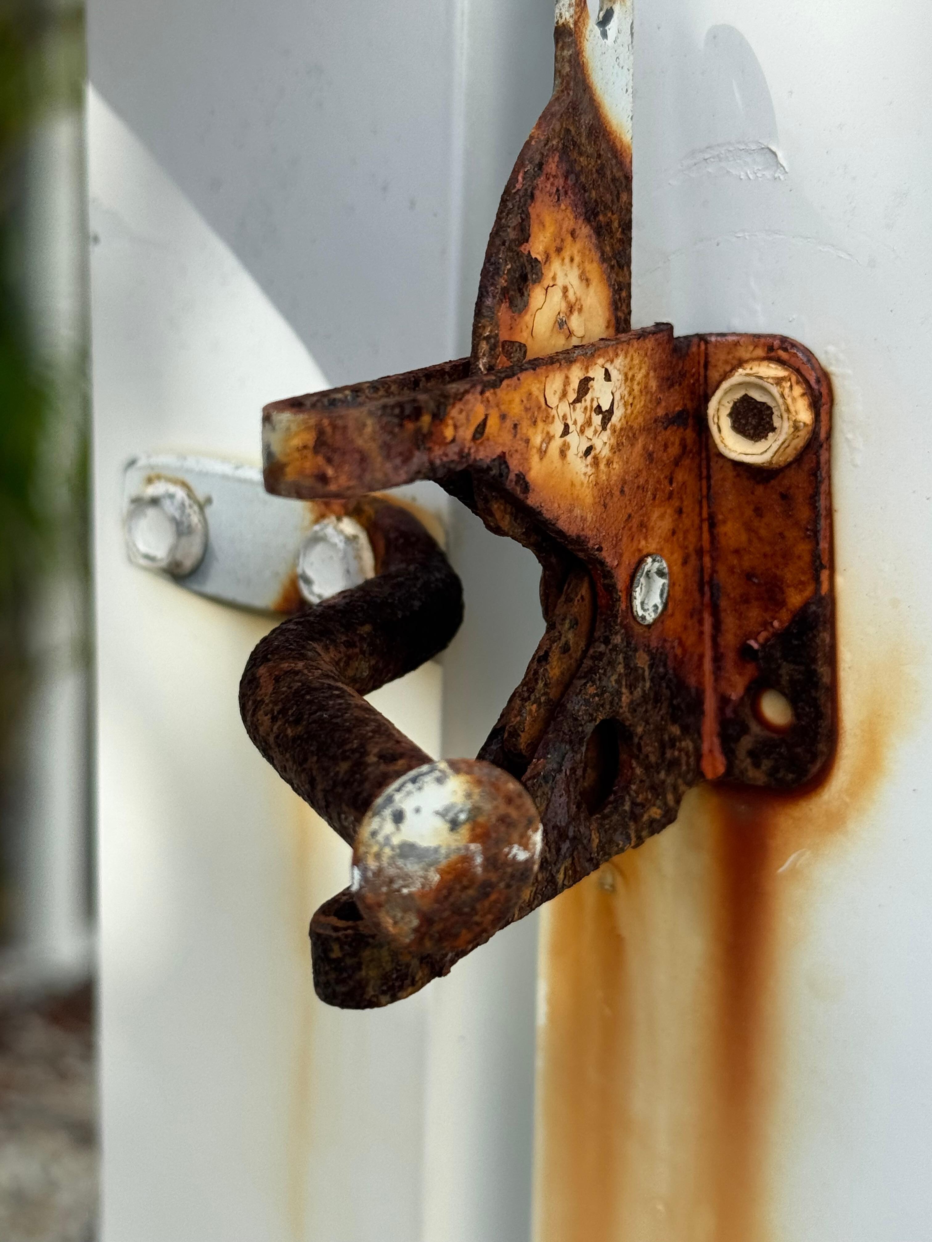 This is one pool gate latch that is rusted and gate is bent so it no longer latches.