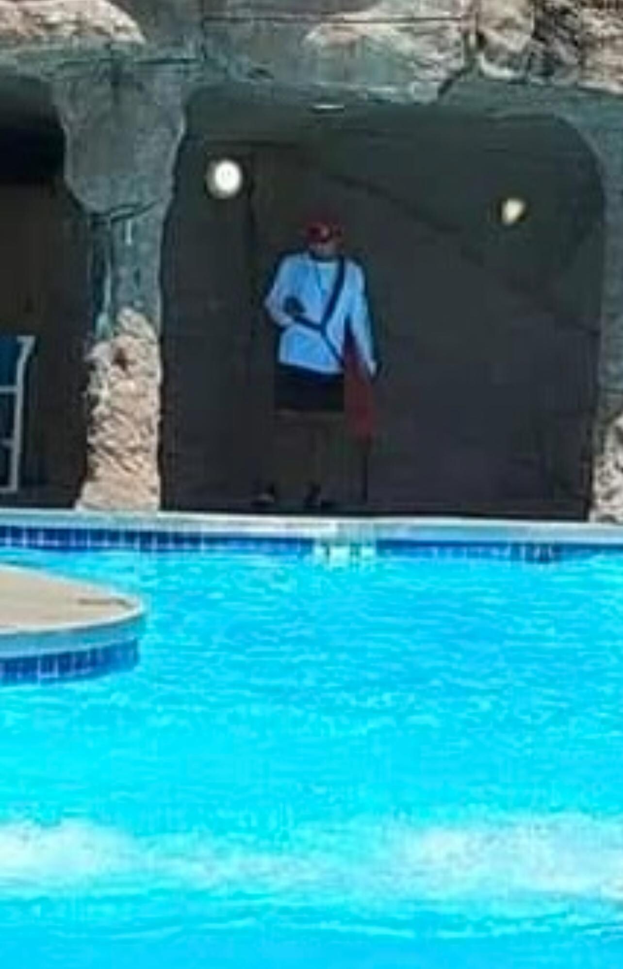 Lifeguard on the phone (kids in the pool cropped out)