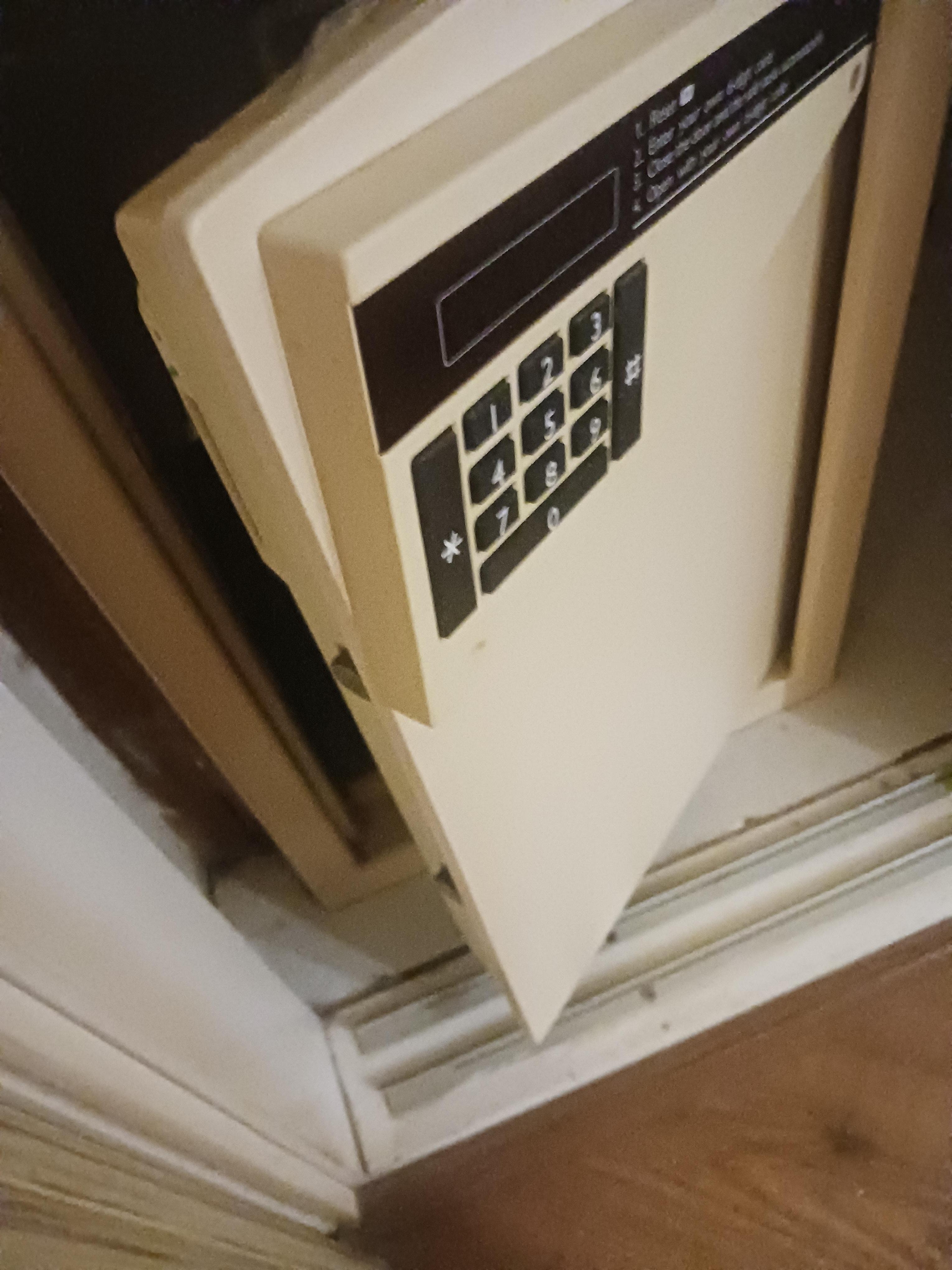 Broken safe partly held together with sellotape - unuseable.