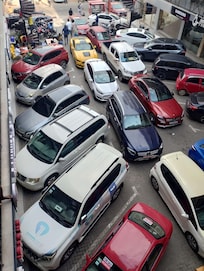 My car is the one with a roof rack. 3rd Car counting from the red car with the "for sale sign" I couldn't move my car. I had to take Bolt to go out.