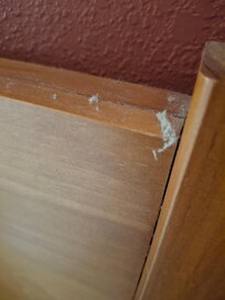 Dust on bed headboard.