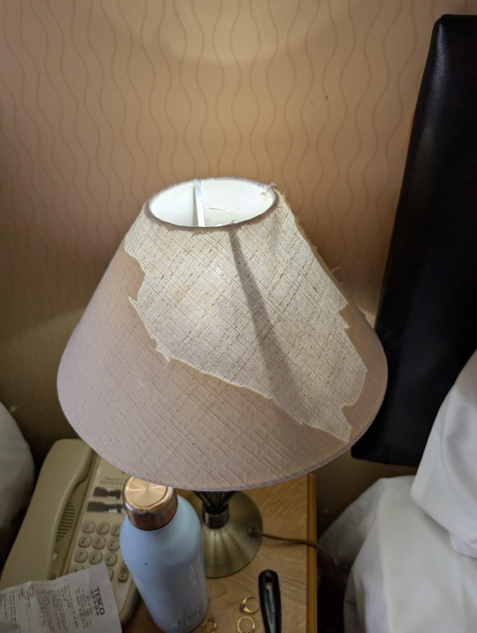 Dilapidated lampshade in bedroom 