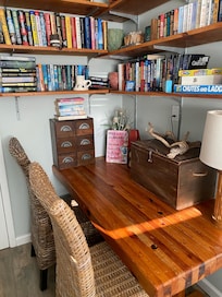 Books for exchange or keep inside laundry room.