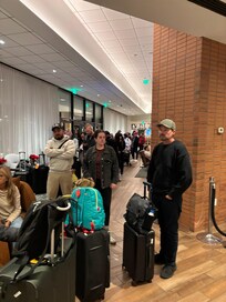 Line of people waiting to check in.