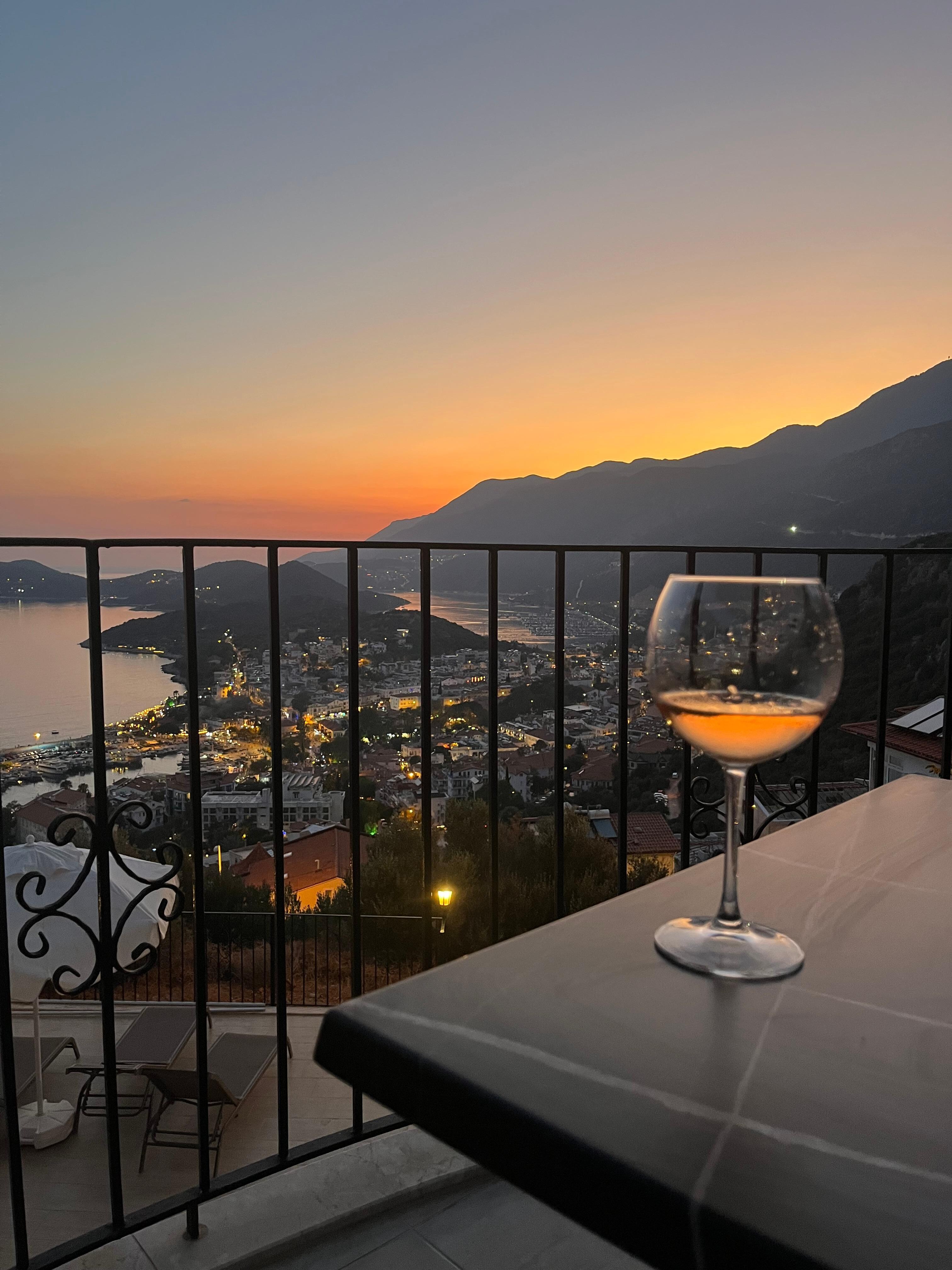 Photo of sunset from balcony with local rose wine