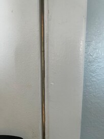 Gap in door large enough that I could see people moving around outside the door