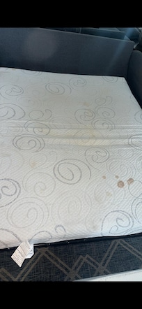 Stained mattress Did not have a mattress cover on it