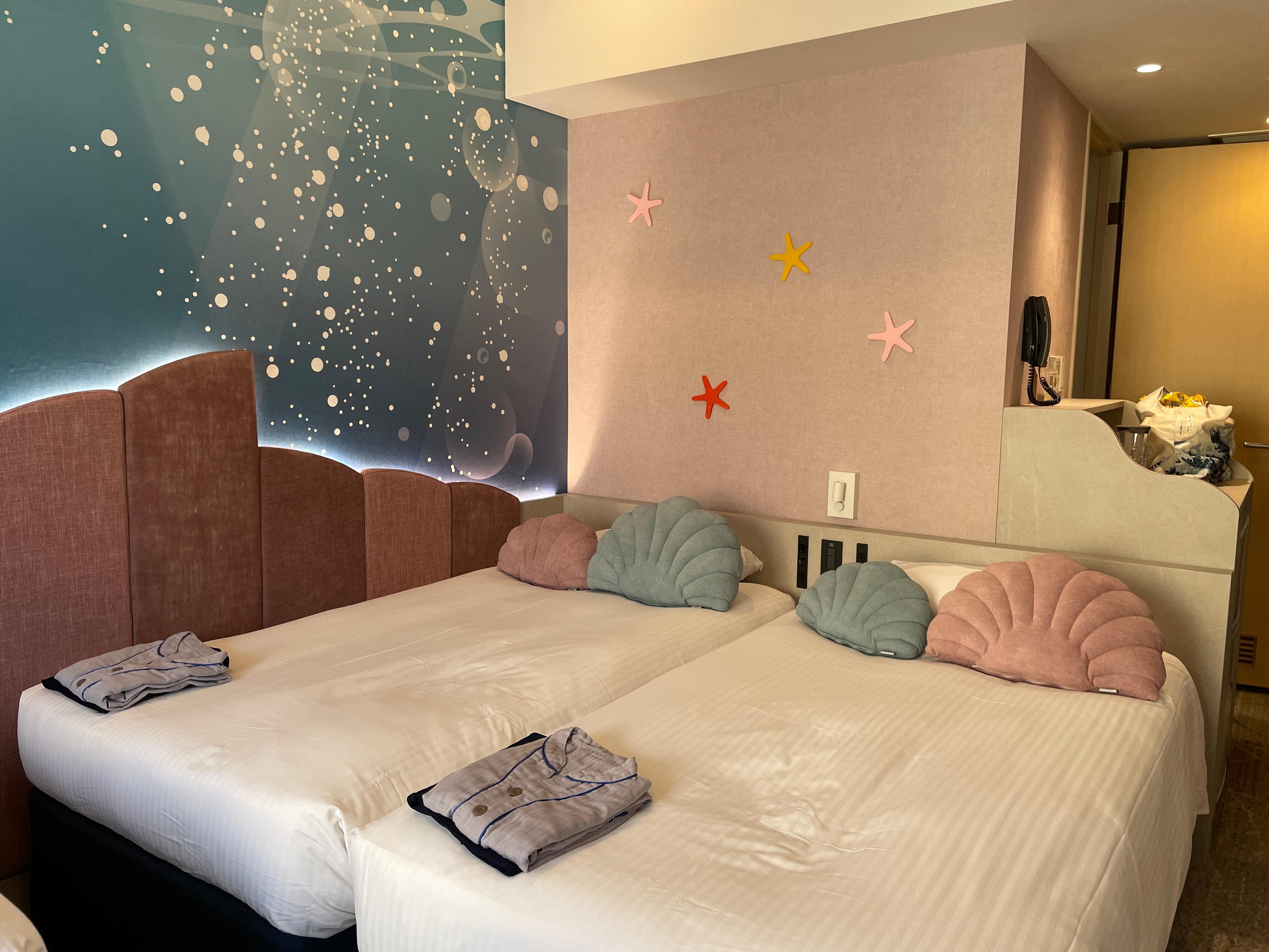 2 of the 3 beds in the room. 