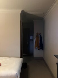 Entrance hall with wardrobe and mirror but no light