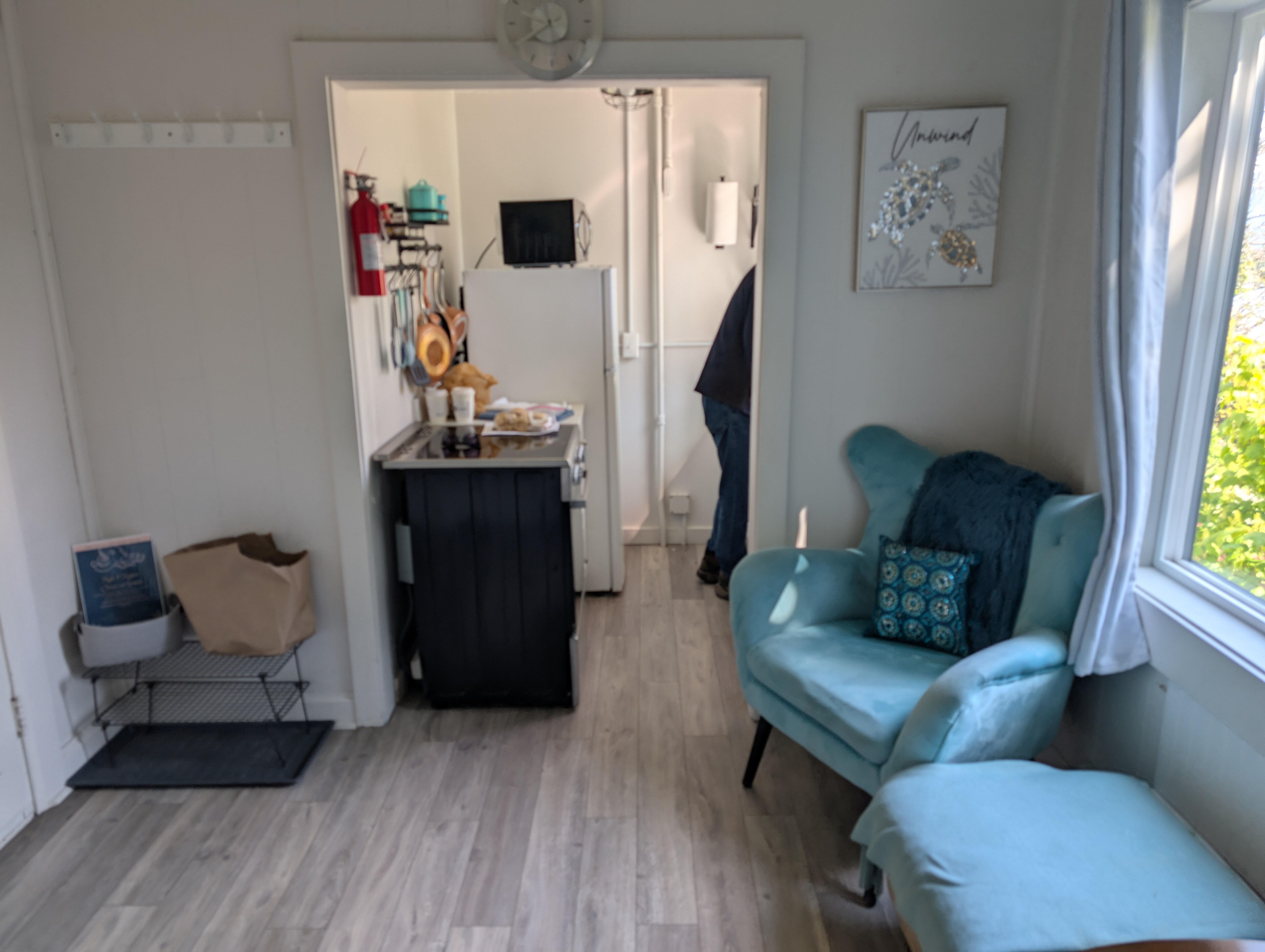 living area and partial view of kitchen; white chair was at the bottom side of this photo & not shown here.