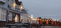 The Victory Hotel at night.